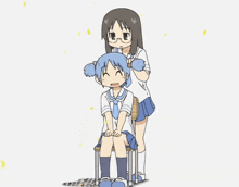 a girl is brushing another girl 's hair while the girl sits on a chair