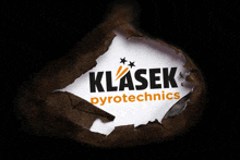 a hole in a piece of paper that says klasek pyrotechnics on it