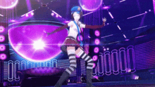 a girl in a striped skirt is dancing on a stage in front of a disco ball .