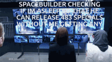 a group of people looking at a screen with the caption spacebuilder checking