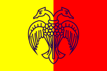 a yellow and red flag with a blue drawing of a bird