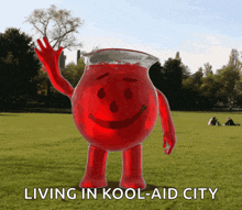 a pitcher of kool-aid is standing in a field