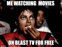 a man in a red jacket is watching a movie on blast tv for free .