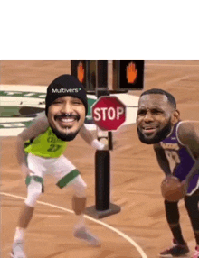 two basketball players standing next to a stop sign on the court