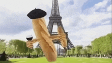 a baguette is holding a glass of wine in front of the eiffel tower in paris .