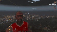 a man in a red chicago bulls jersey stands in front of a city skyline