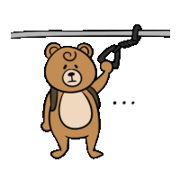 a brown teddy bear with a backpack is holding a handle on a railing