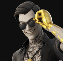 a man wearing sunglasses and a gold fist is smiling and holding a gold fist .