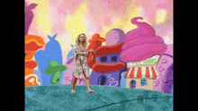 a woman in a bathrobe is standing in front of a cartoon ice cream shop