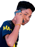 a boy wearing a blue shirt with the word ma on it talking on a cell phone