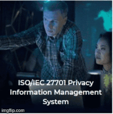 a man and a woman looking at a computer screen with the words iso / iec 27701 privacy information management system on the bottom