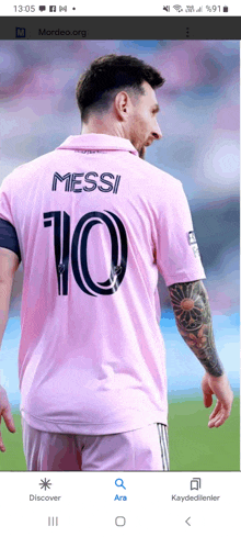 a soccer player wearing a pink shirt with the number 10 on the back