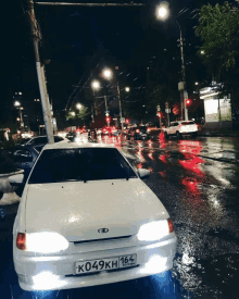 a white car with russian license plate k049kh 164