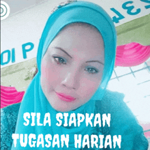 a woman wearing a blue hijab has the words sila siapkan tugasan harian written on her face