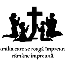 a family is praying in front of a cross with a quote in a foreign language .