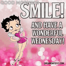 betty boop is smiling and wishing you a wonderful wednesday .