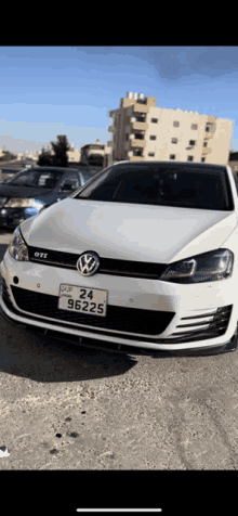 a white volkswagen gti with a license plate that says 96225