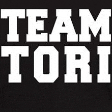 a black background with white letters that say team tori .