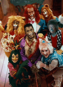 a group of people dressed as animals are posing for a picture together