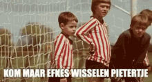 a group of young boys are standing in front of a soccer goal with the caption kom maar efkes wisselen pietertje .