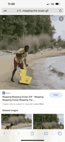 a phone screen shows a man mopping the ocean with a yellow mop