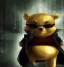 a winnie the pooh teddy bear wearing sunglasses and a black coat .