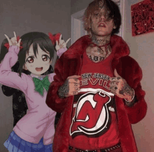 a man wearing a new jersey devils shirt stands next to a girl