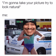 a picture of a man standing in front of a nypd police vehicle