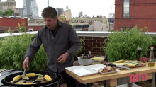 a man is grilling corn on the cob in front of a table that says ' tasted ' on it