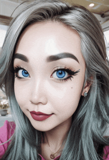 a close up of a woman 's face with blue eyes and gray hair