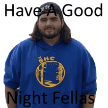 a man wearing a blue shirt that says ' have a good night fellas '