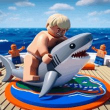 a lego man is riding on the back of a shark on a boat