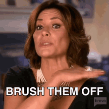 a woman says " brush them off " in a bravo ad