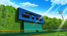 a scoreboard at a baseball stadium shows the score of a game