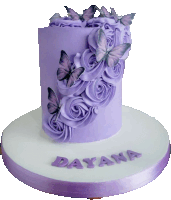 a purple cake with butterflies and the name dayana written on it