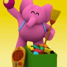 a stuffed elephant is standing next to a box of toys