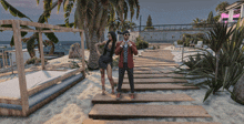 a man and a woman standing on a wooden walkway on a beach