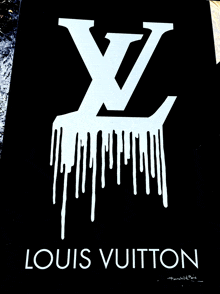 a black and white louis vuitton sign with a white lv logo