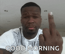 a man giving the middle finger with the words " good morning " behind him