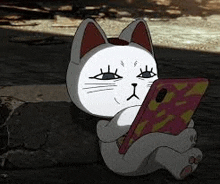 a cartoon cat is sitting on the ground holding a cell phone .