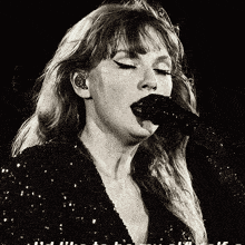 a black and white photo of a woman singing into a microphone with the words " i 'm a singer " visible