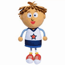 a stuffed toy of a boy wearing a blue and white jersey with a star on it and red shoes .