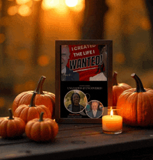 a framed poster that says " i created the life i wanted " is surrounded by pumpkins