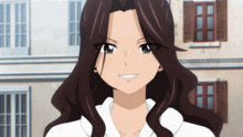 a girl with long brown hair and a white shirt is smiling