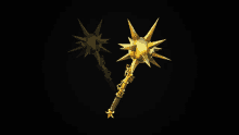 two golden weapons with spikes on them are on a black background