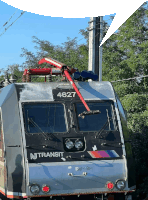 a silver and black train with the number 467 on the front