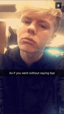 a young man is taking a selfie with a caption that says " as if you went without saying bye "