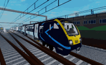 a blue and yellow train with the numbers 720520 on the front