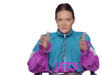 a woman in a purple and blue jacket is making a funny face and the word see is behind her