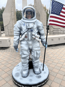 a statue of a man in a nasa space suit